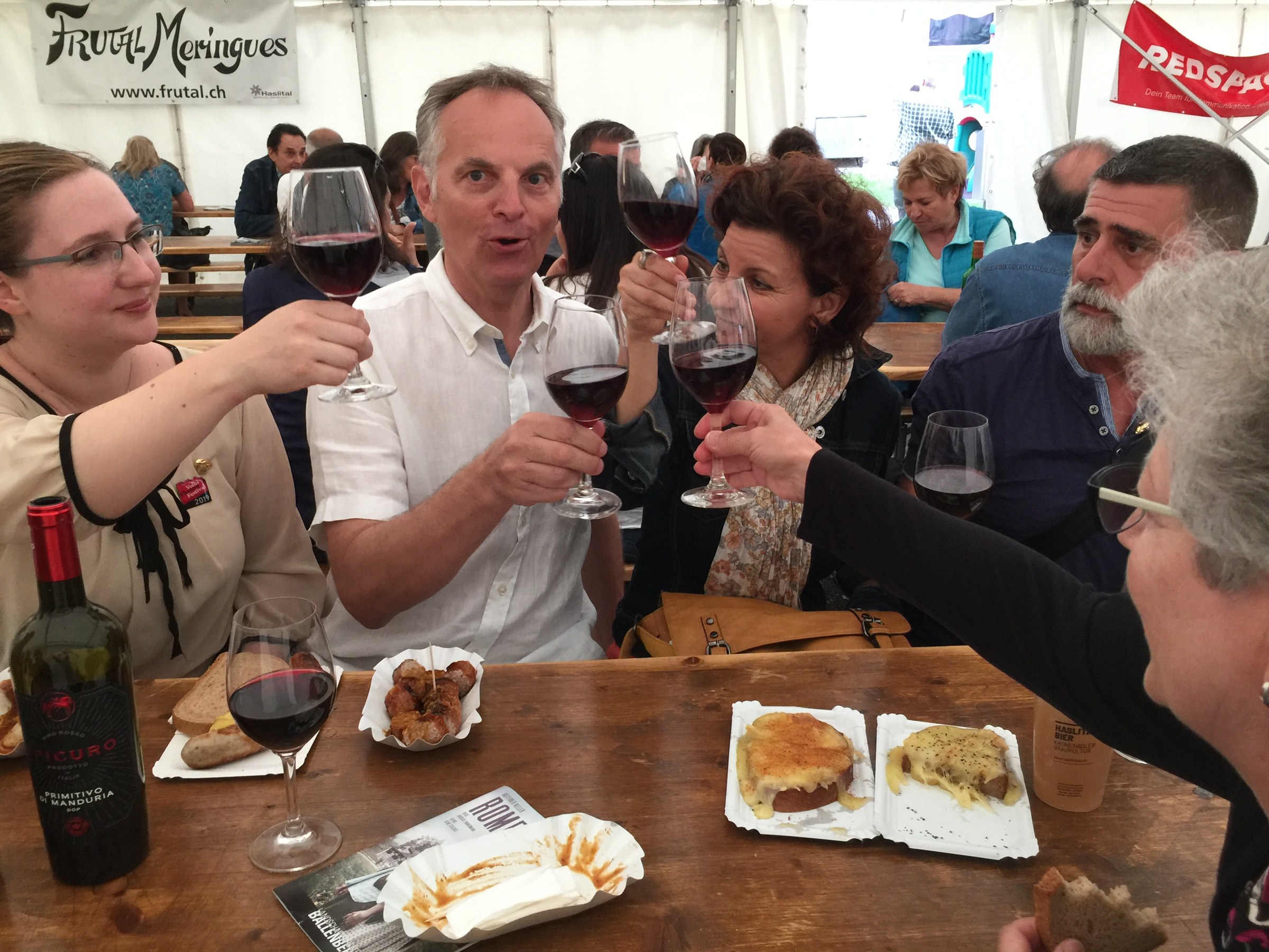 Raising glasses in the festival tent 2019
